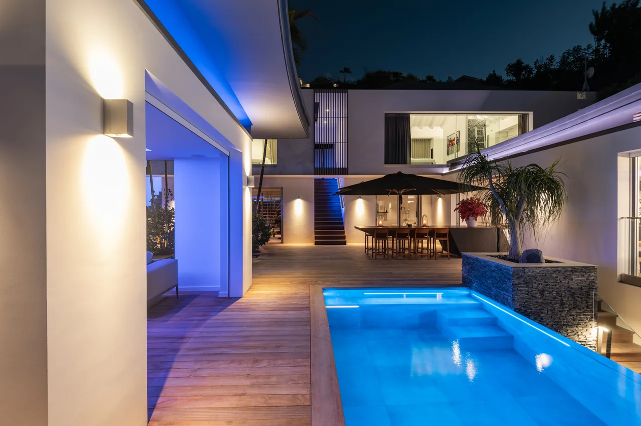 The terrace and pool at nightfall